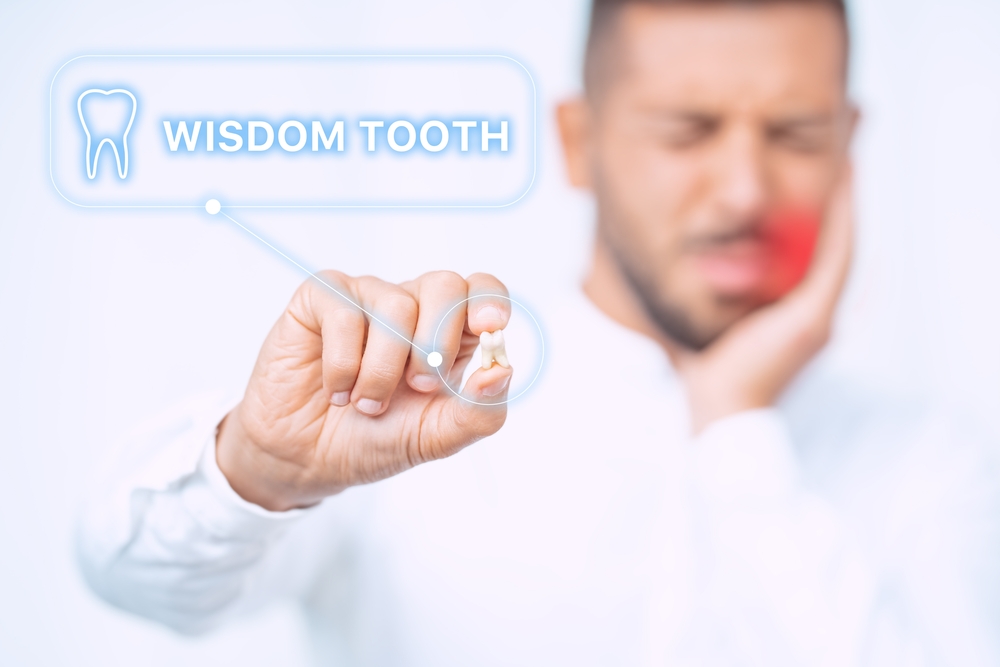 man,with,extracted,wisdom,tooth.,man,after,wisdom,teeth,removal
